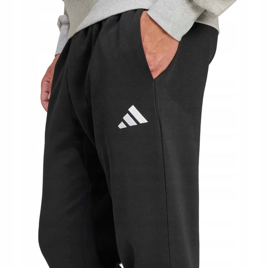 Adidas pantalone felpa con polsino m feelcozy nero/bianco
